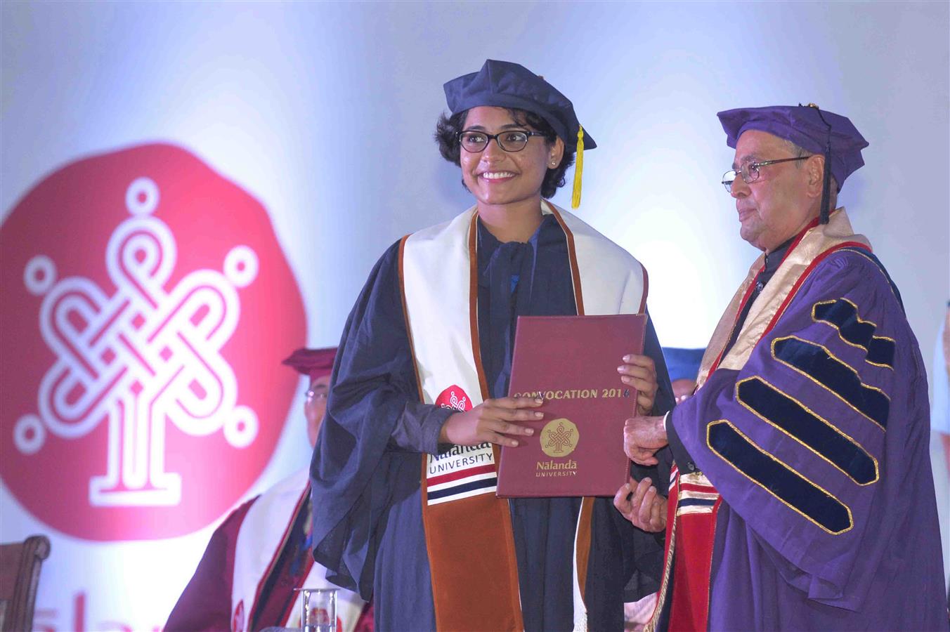 The President of India, Shri Pranab Mukherjee presenting the degree to a student at the first convocation of Nalanda University at Rajgir, Nalanda in Bihar on August 27, 2016. 