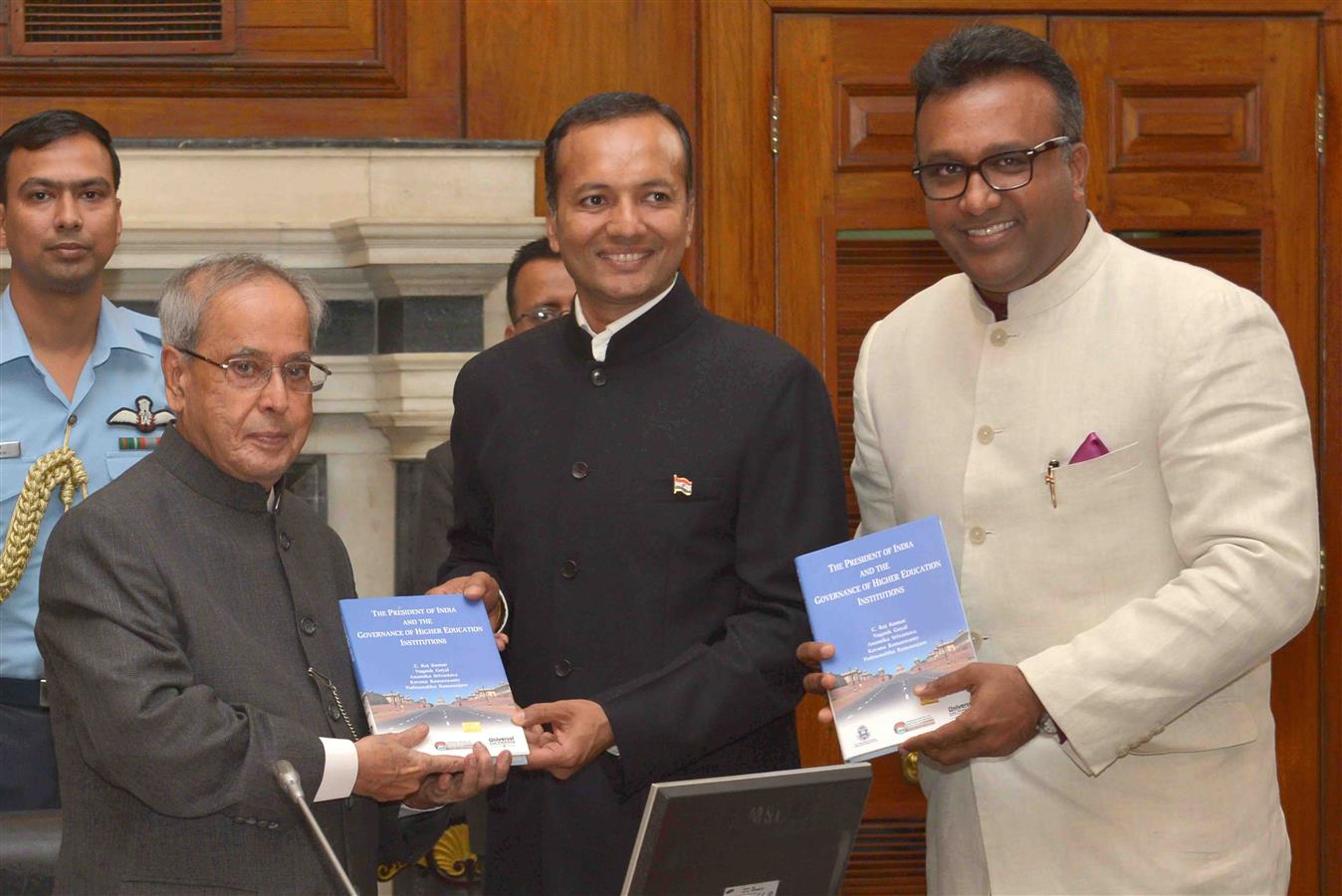 The President of India, Shri Pranab Mukherjee receiving the copy of a book ‘The President of India and the Governance of Higher Education Institutions’ from the Founding Chancellor Mr. Naveen Jindal and Founding Vice Chancellor, Professor (Dr.) C. Raj Ku