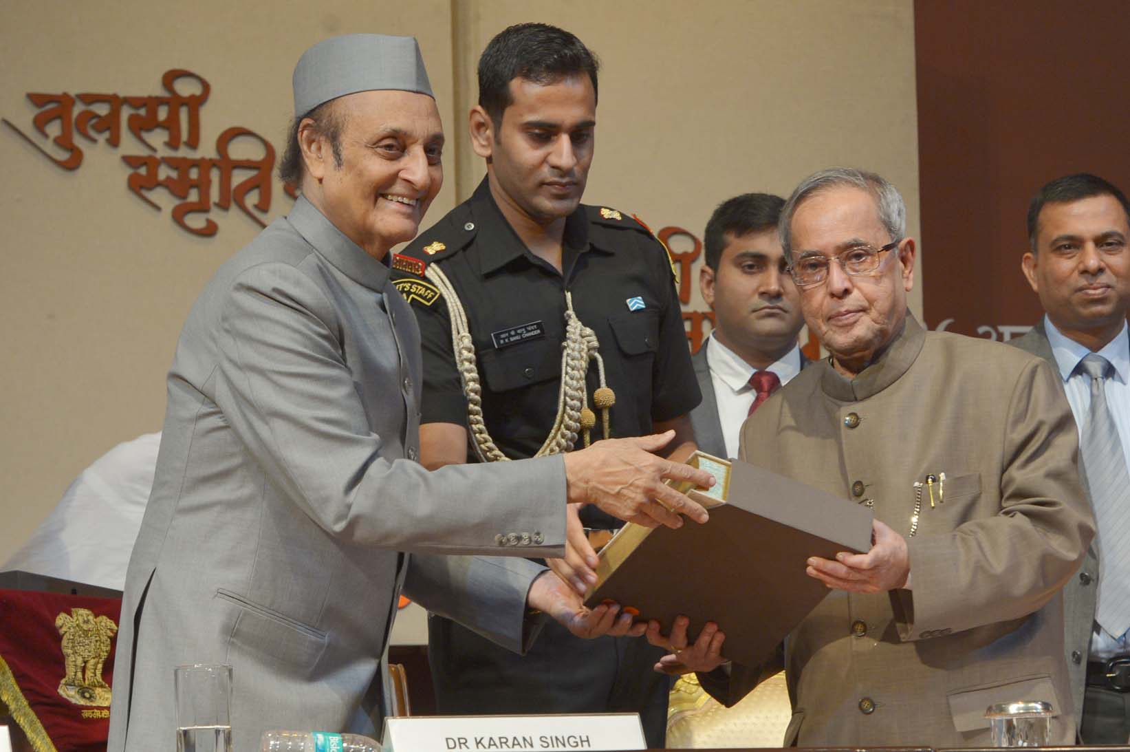 The President of India, Shri Pranab Mukherjee receiving the first copy of “Tulsi Smriti Granth” on Acharya Tulsi at Rashtrapati Bhavan on(October 26, 2014. 