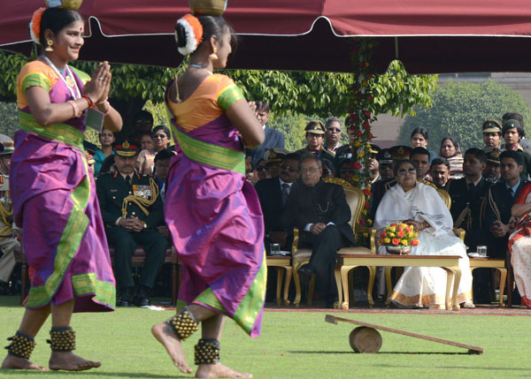 The President of India, Shri Pranab Mukherjee witnessing a performance by artistes who took part in the 65th Republic Day Parade. The President had invited tribal guests, tableaux artists, tractor drivers, NSS volunteers and NCC Cadets who took part in th 