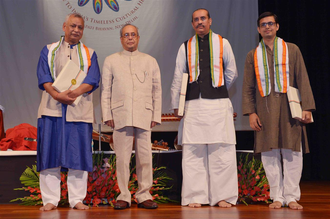 The President of India, Shri Pranab Mukherjee with artists after witnessing a Rudra Veena Performance by Ustad Bahauddin Dagar at Rashtrapati Bhavan Cultural Centre (RBCC) on September 24, 2016. 