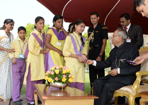 The President of India, Shri Pranab Mukherjee receiving greetings from various school students on the occasion of Diwali at Rashtrapati Bhavn in New Delhi on November 03, 2013.