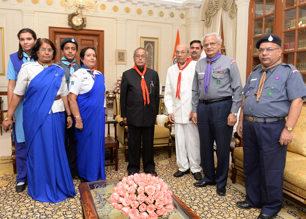 A Delegation from the Bharat Scouts and Guides, National Headquarters Presenting the Bharat Scouts and Guides Flag Sticker to the President of India, Shri Pranab Mukherjee at Rashtrapati Bhavan in New Delhi on November 9, 2013 when they called-on the Pre