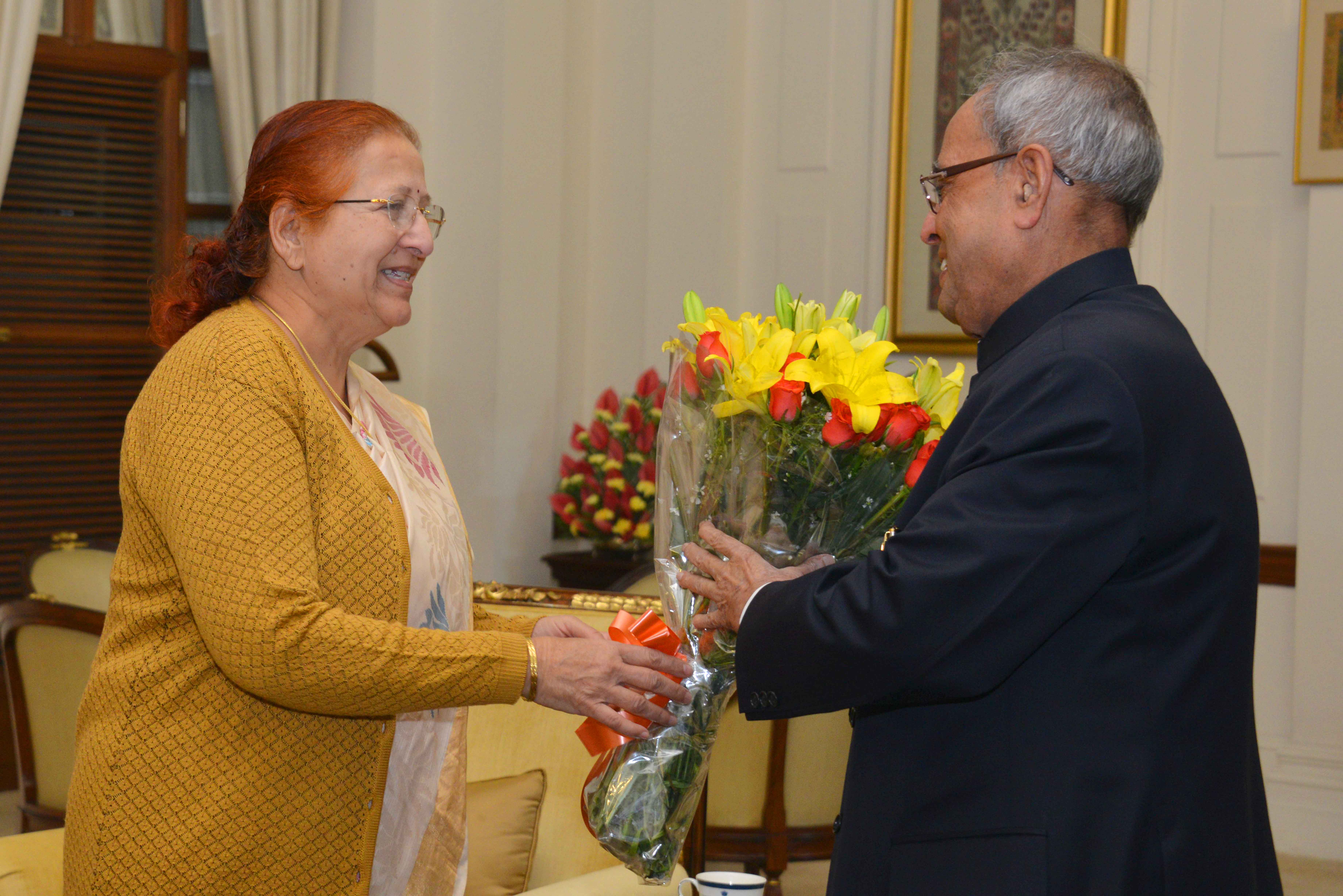 The President of India, Shri Pranab Mukherjee being greeted at Rashtrapati Bhavan on December 11, 2014 by the Speaker of Lok Sabha, Smt. Sumitra Mahajan on the occasion of his birthday. 