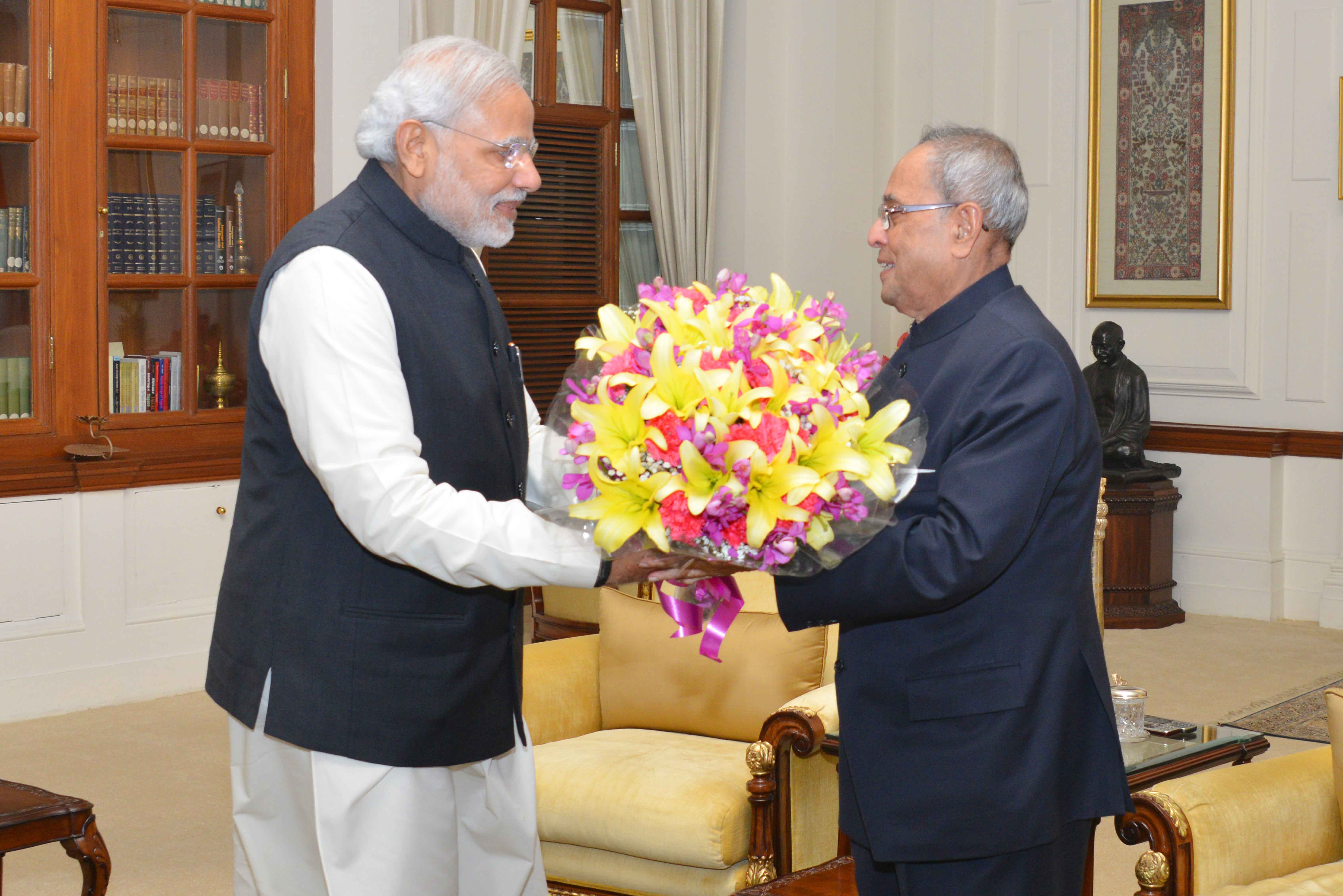 The President of India, Shri Pranab Mukherjee being greeted at Rashtrapati Bhavan on December 11, 2014 by the Prime Minister of India, Shri Narendra Modi on the occasion of his birthday. 