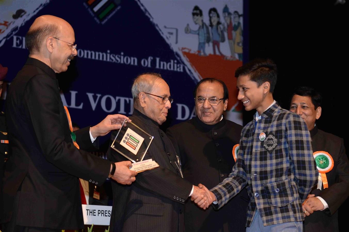 The President of India, Shri Pranab Mukherjee presenting the Election Photo Identify Cards [EPICs] to newly registered young voter at the 6th National Voters' Day Celebration organized by the Election Commission of India in New Delhi on January 25, 2017.