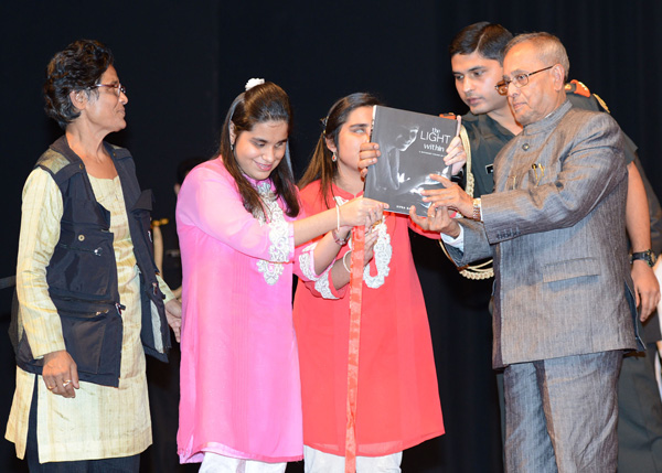 The President of India, Shri Pranab Mukherjee receiving the first copy of the Book' The Light Within' by Ms. Sipra Das at Rashtrapati Bhavan Auditorium in New Delhi on November 18, 2013.