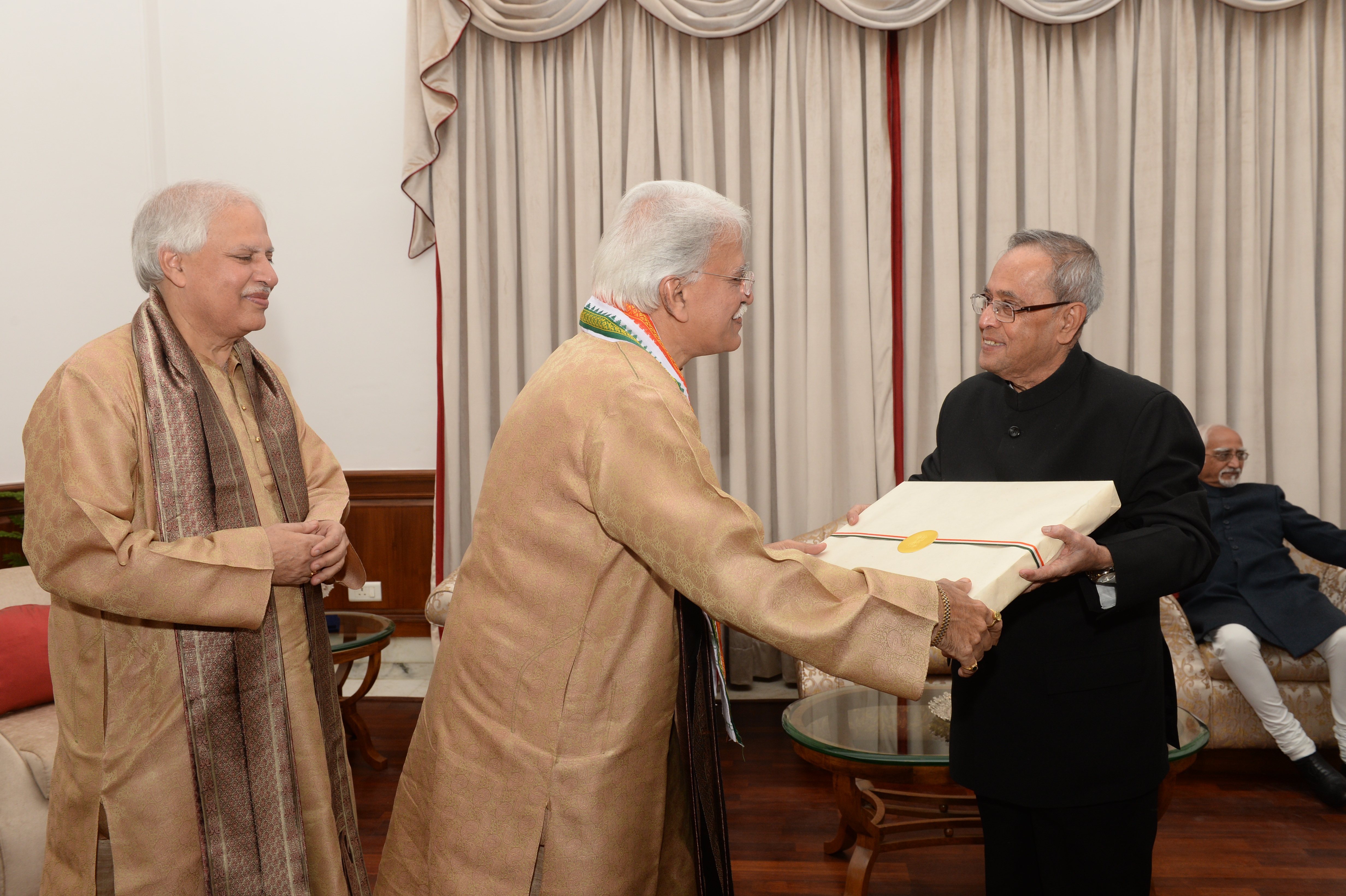 The President of India, Shri Pranab Mukherjee being felicitated Pandit Rajan and Sajan Mishra after witnessing a Vocal recital performance at Rashtrapati Bhavan Auditorium on December 12, 2014.