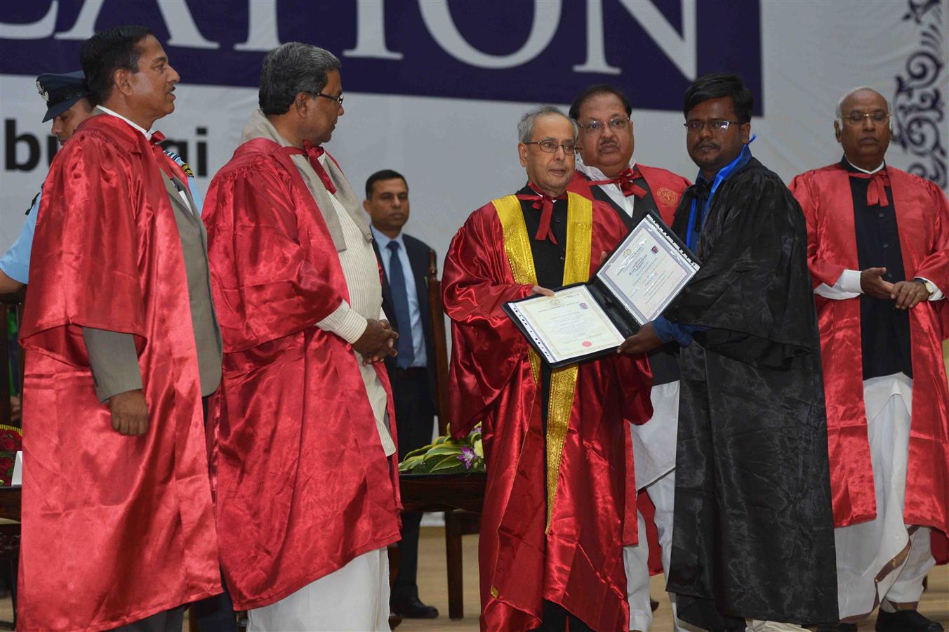 The President of India, Shri Pranab Mukherjee presenting the degree certificate to a Student at the 2nd Convocation of Central University of Karnataka at Kalaburagi in Karnataka on December 22, 2014. 