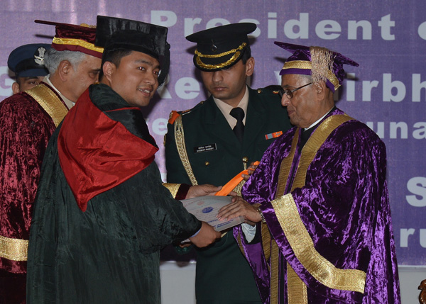 The President of India, Shri Pranab Mukherjee while presenting a degree to the student at the XII Convocation of Rajiv Gandhi University at Doimukh in Arunachal Pradesh on November 30, 2013. Also seen is the Governor of Arunachal Pradesh, Lt. General(Ret