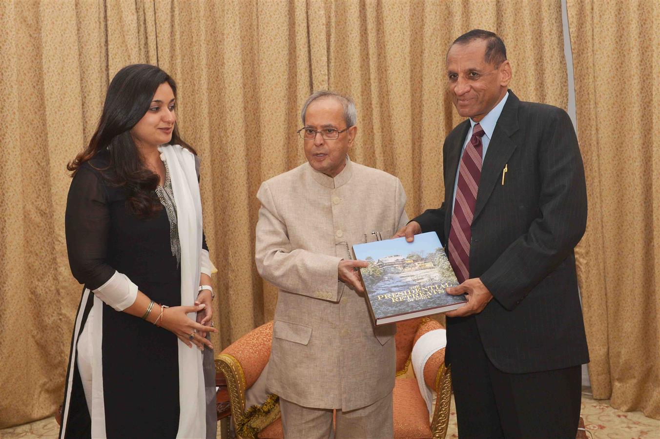 The President of India, Shri Pranab Mukherjee presenting a copy of a book on Rashtrapati Nilayam, Secunderabad to Shri ESL Narasimhan, Governor of Telangana and Andhra Pradesh at Rashtrapati Nilayam, Secunderabad on December 21, 2015.