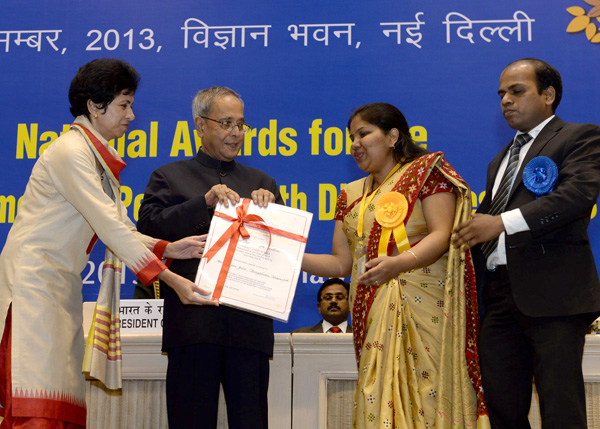 The President of India, Shri Pranab Mukherjee while presenting a National Award for the Empowerment of Persons with Disabilities for the year 2013 on the occasion of International Day of Disabled Persons at Vigyan Bhavan, New Delhi on December 3, 2013.