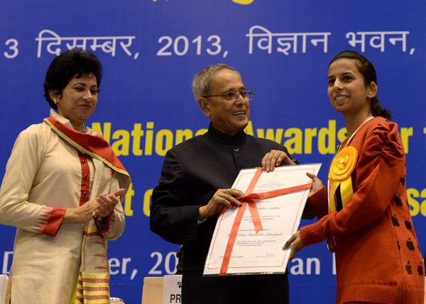 The President of India, Shri Pranab Mukherjee while presenting a National Award for the Empowerment of Persons with Disabilities for the year 2013 on the occasion of International Day of Disabled Persons at Vigyan Bhavan, New Delhi on December 3, 2013.