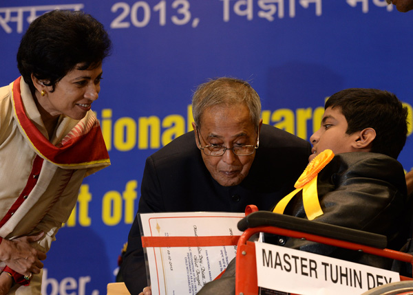 The President of India, Shri Pranab Mukherjee while presenting a National Award for the Empowerment of Persons with Disabilities for the year 2013 on the occasion of International Day of Disabled Persons at Vigyan Bhavan, New Delhi on December 3, 2013.