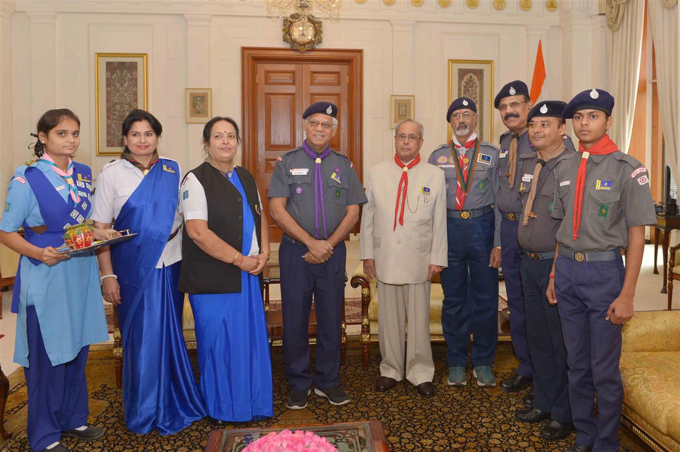 A Delegation from Bharat Scouts and Guides (National Headquarters) pinning the flag sticker on the President of India, Shri Pranab Mukherjee at Rashtrapati Bhavan on their Flag Day on November 7, 2016. 