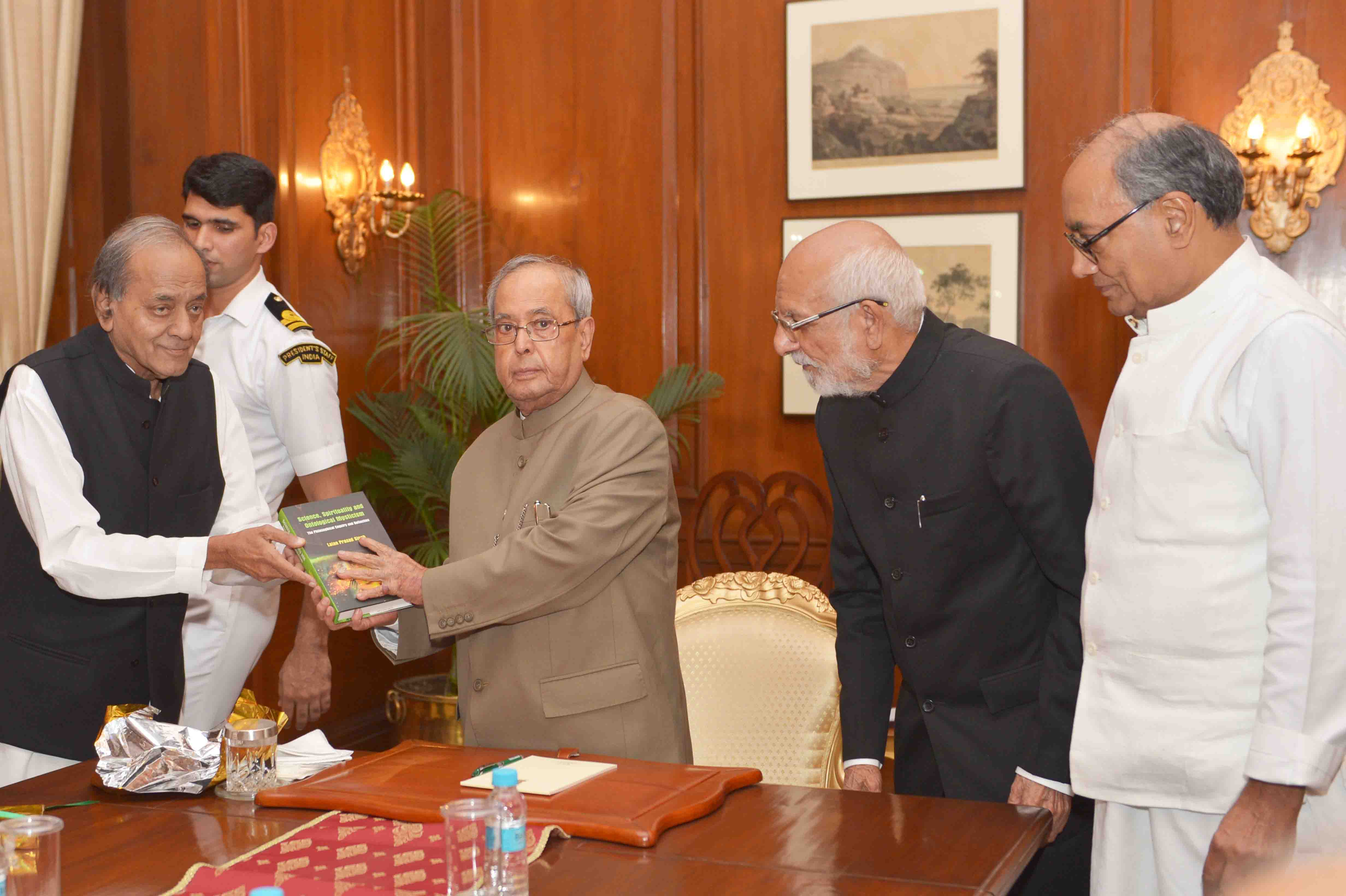 Dr. L.P. Singh along with committee members presenting a copy of book "Science, Spirituality and Ontological Mysticism - The Philosophical Enquiry an Reflection" to the President of India, Shri Pranab Mukherjee at Rashtrapati Bhavan on November 9, 2016. 