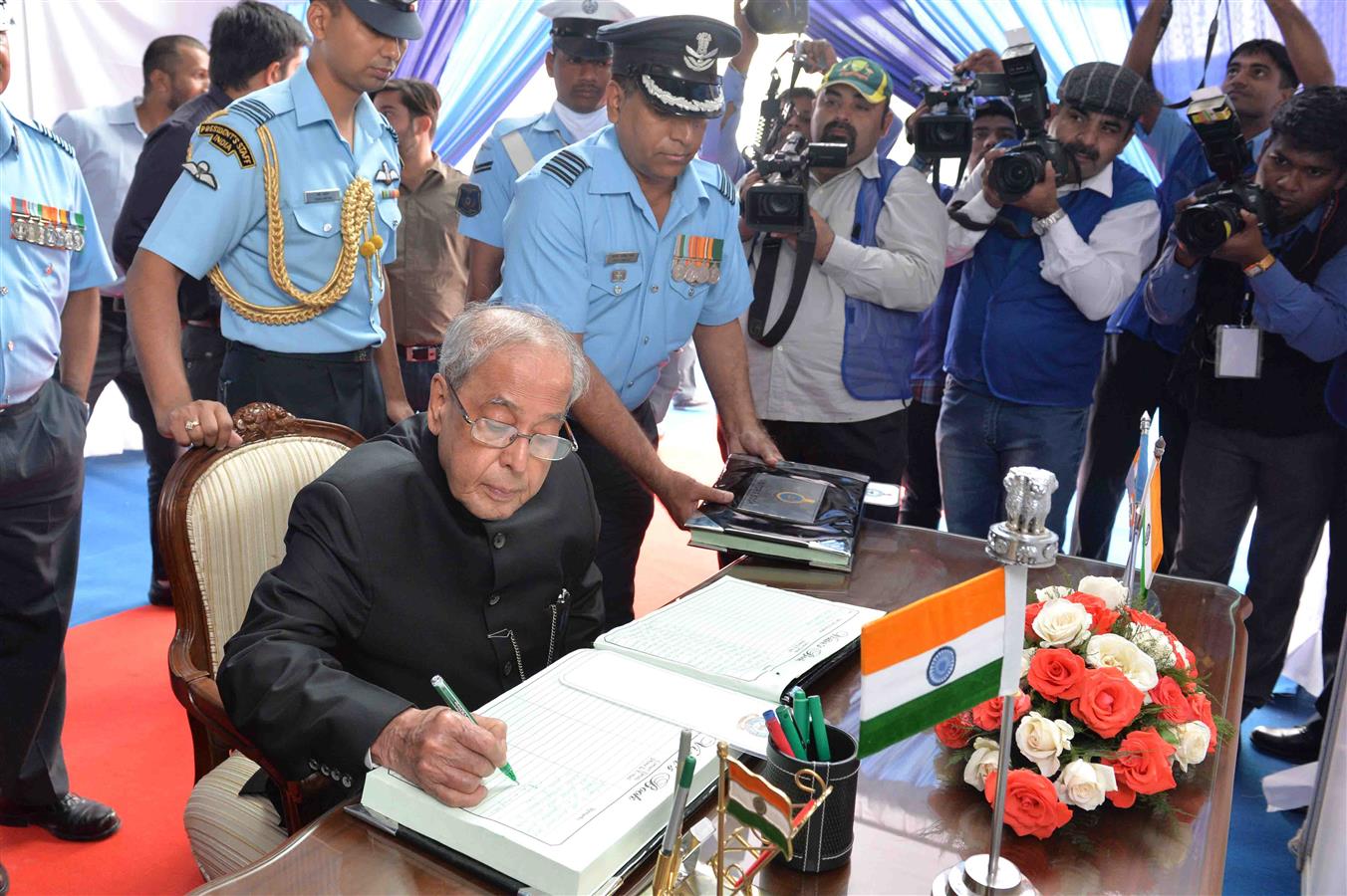 The President of India, Shri Pranab Mukherjee signing of Blow-Ups and Recipient Units Visitor Book at the presentation of Standards to 501 Signal Unit and 30 Squadron of Indian Air Force at Air Force Station, Ambala in Haryana on November 10, 2016. 