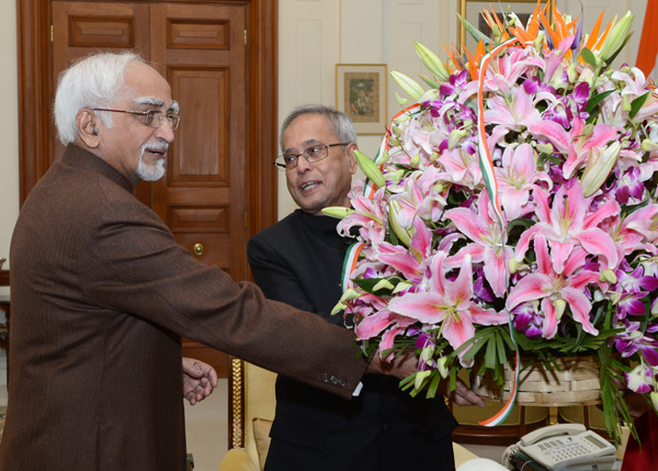 The President of India, Shri Pranab Mukherjee receiving Birthday Greeting from the Vice President of India, Shri Mohd. Hamid Ansari at Rashtrapati Bhavan in New Delhi on December 11, 2013.