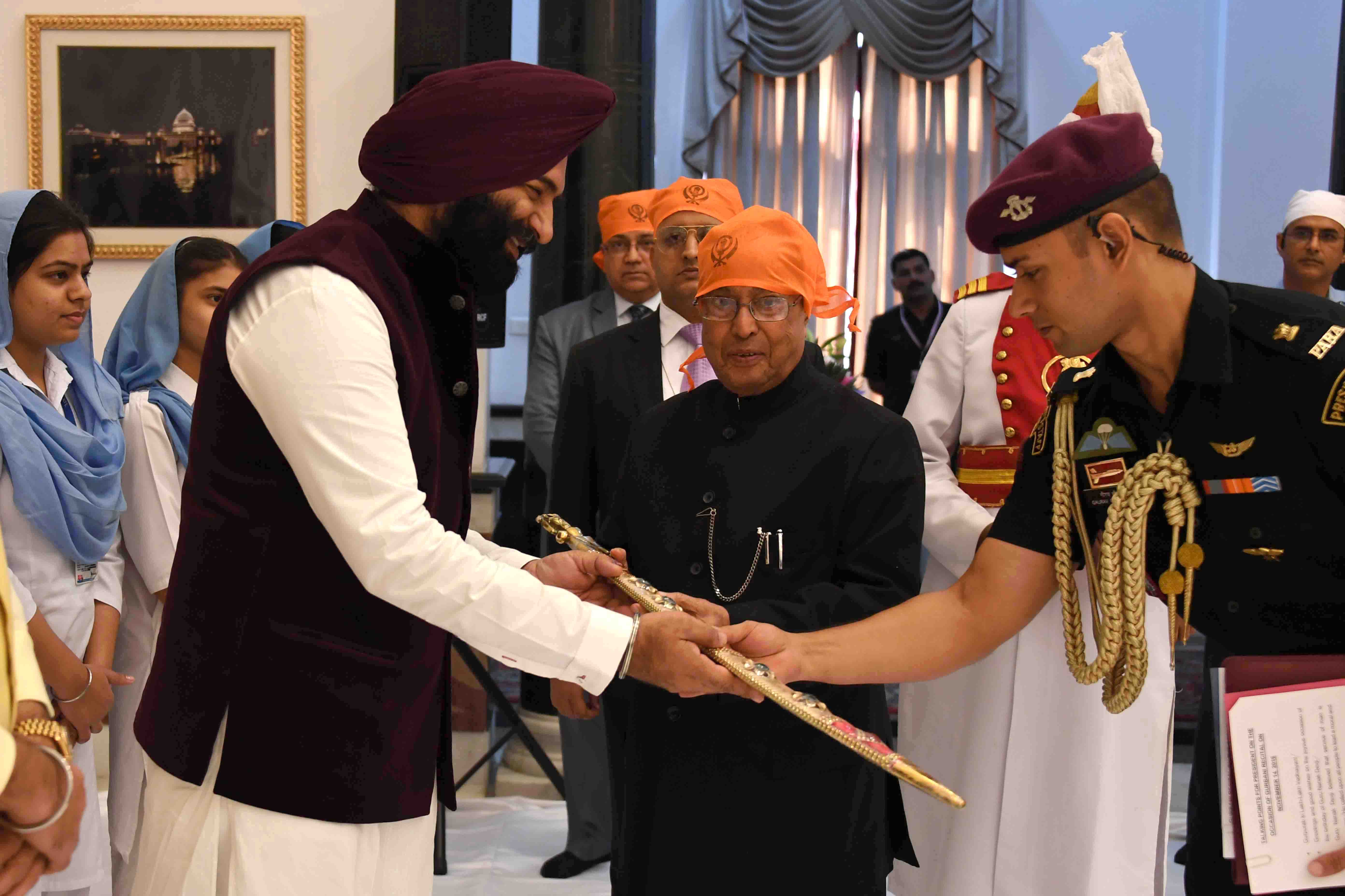 The President of India, Shri Pranab Mukherjee being presented with a shawl, kirpan and saropa at Rashtrapati Bhavan Cultural Centre on November 14, 2016 at the Gurbani Recital on the occasion of the Birth Anniversary of Guru Nanak Devji. 