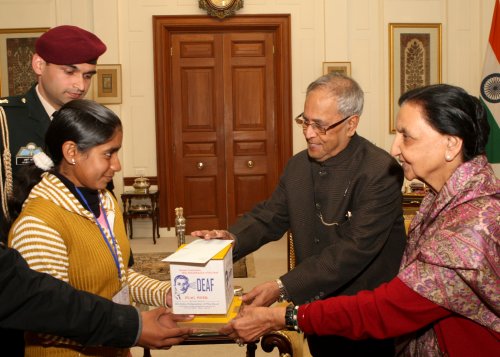 The President of India, Shri Pranab Mukherjee making a contribution to the All India Federation of the Deaf at Rashtrapati Bhavan in New Delhi on February 1, 2013 on the occasion of their Flag Week, during a call by members of the Federation.