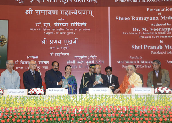 The President of India, Shri Pranab Mukherjee receiving a copy of book entitled ‘Shri Ramayana Mahnveshanam’ (in two volumes) of the Union Minister of Petrolium and Natural Gas and Environment and Forests, Shri. M. Veerappa Moily at Vigyan Bhavan in New 