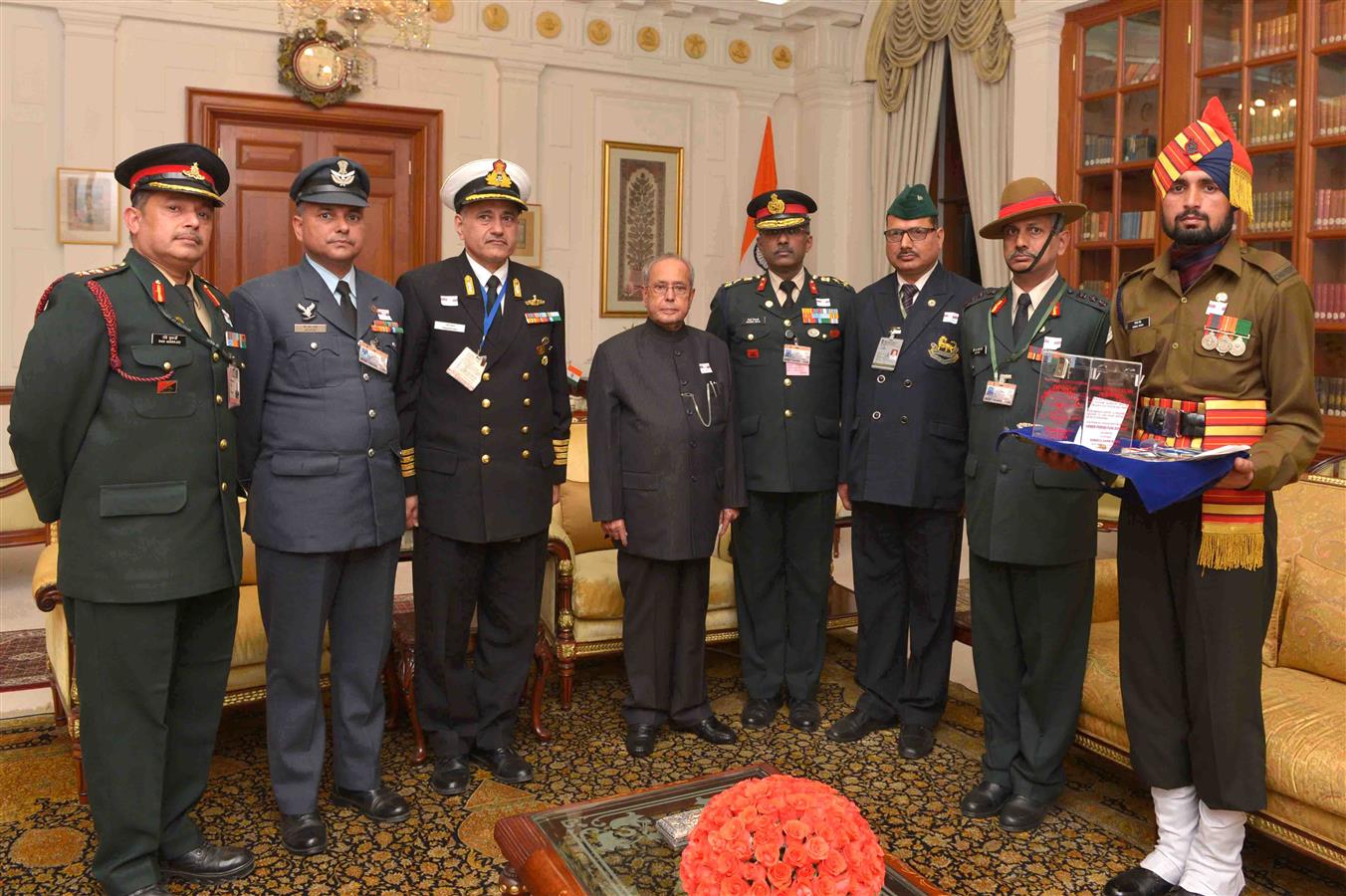 Brig. M.H. Rizvi, VSM, Secretary, Kendriya Sainik Board, Ministry of Defence pinning a flag on the President of India, Shri Pranab Mukherjee on the occasion of Armed Forces Flag Day at Rashtrapati Bhavan on December 7, 2016. 