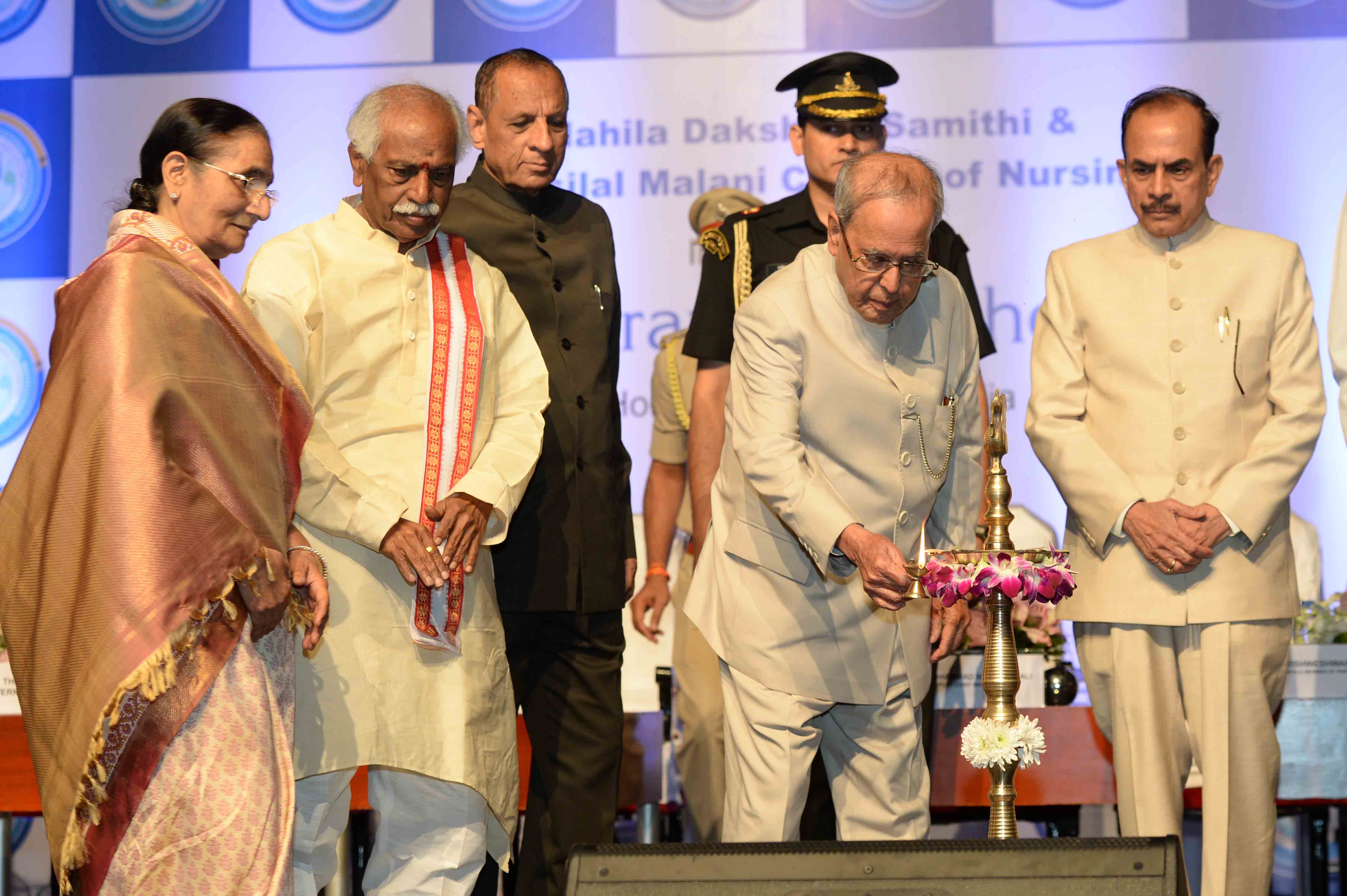 The President of India, Shri Pranab Mukherje lighting the lamp at the inauguration of Mahila Dakshata Samiti and Bansilal Malani College of Nursing at Chanda Nagar in Hyderabad on December 24, 2016. 