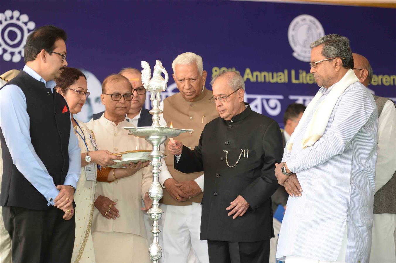 The President of India, Shri Pranab Mukherjee lighting the lamp at the inauguration of the 89th Annual Conference of the Nikhil Bharat Banga Sahitya Sammelan at Bengaluru on December 25, 2016. 