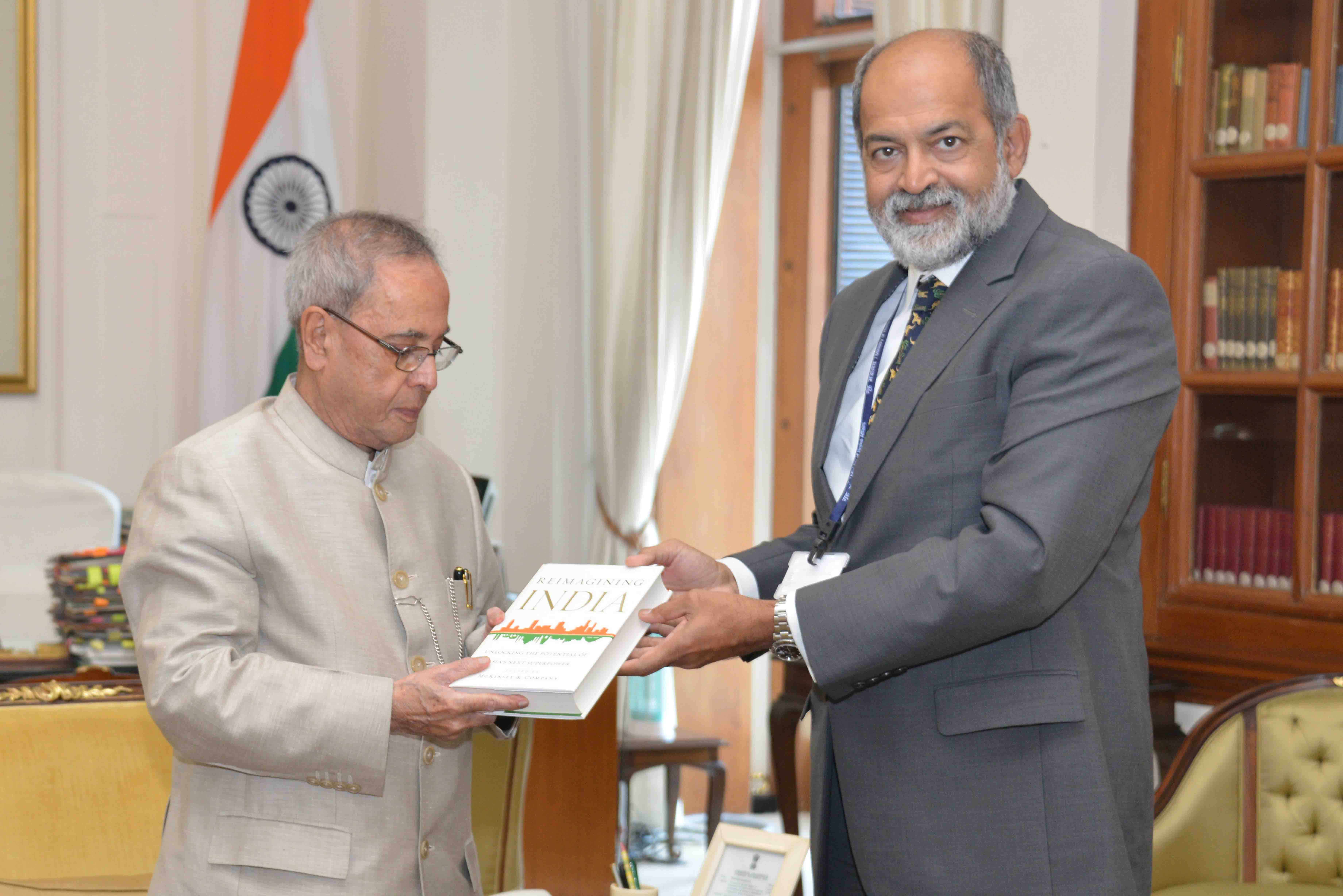 Shri Adil Zainulbhai, Chariman, Quality Council of India and Senior Advisor, McKinsey &amp; Co. presenting a copy of his book 'Reimaging India: Unlocking the potential of Asia's next superpower' to the President of India, Shri Pranab Mukherjee at Rashtrap