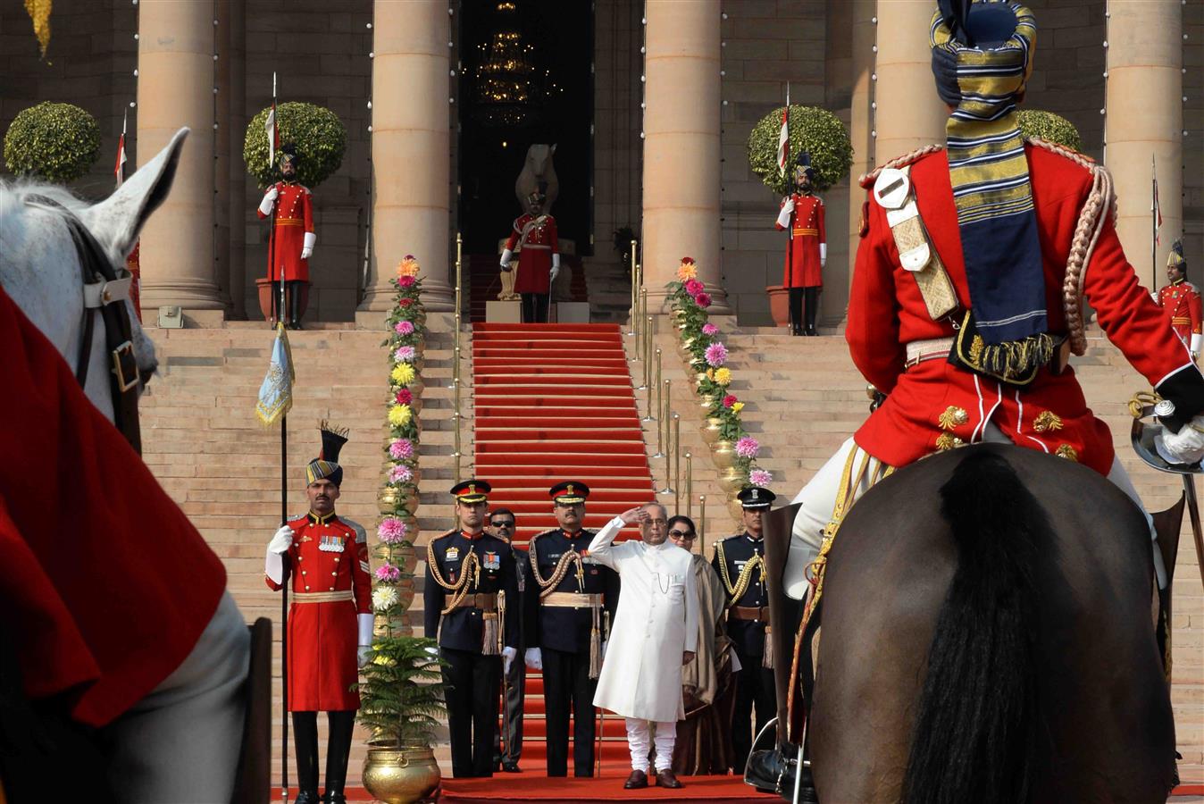 The President of India, Shri Pranab Mukherjee receiving the National Salute from the President's Body Guard (PBG) at Forecourt of Rashtrapati Bhavan before leaving for Central Hall of Parliament to deliver his address to both the Houses of Parliament in N